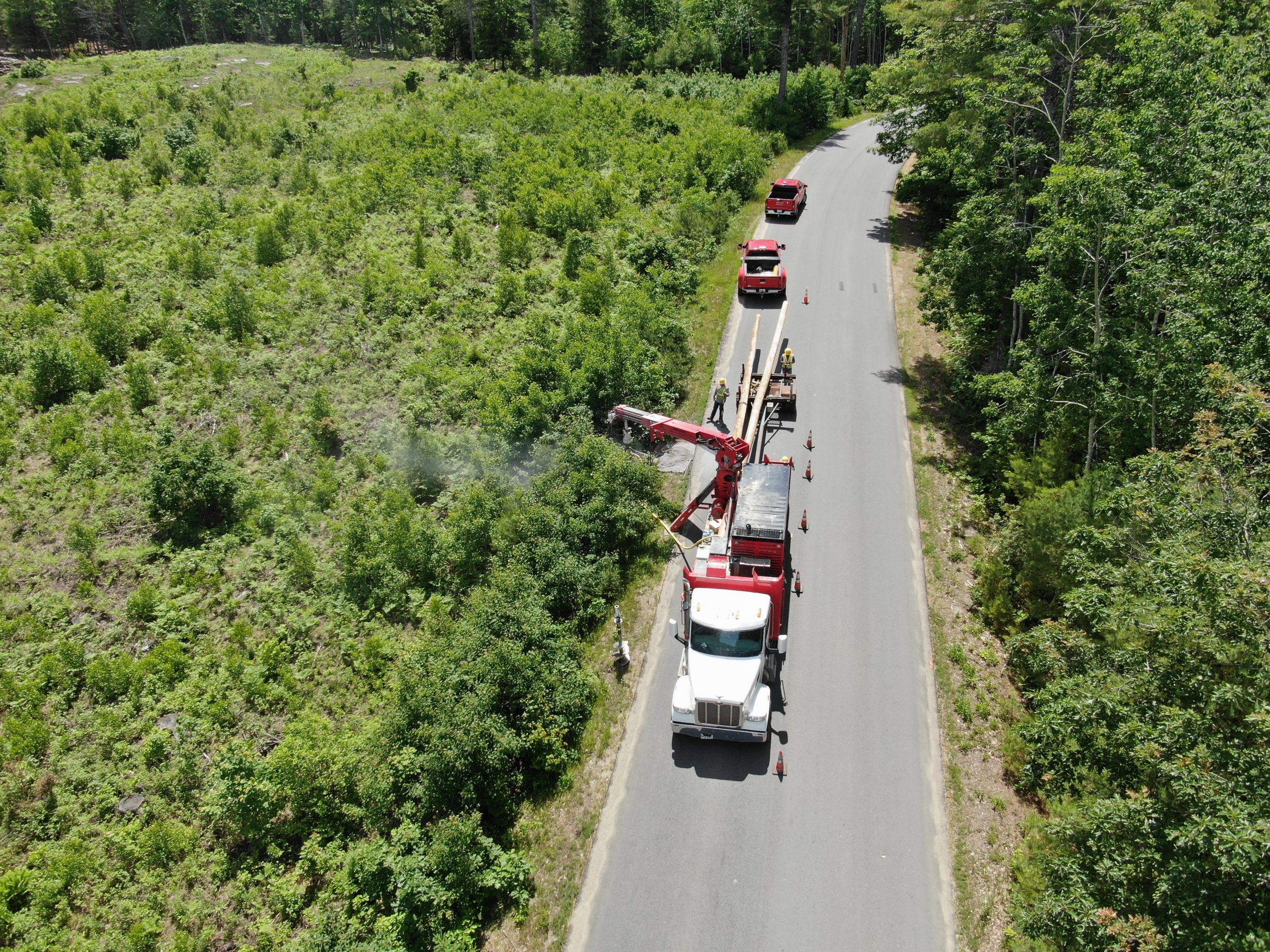 Contact us - Photo from above showing Coutts worker going to work on power lines